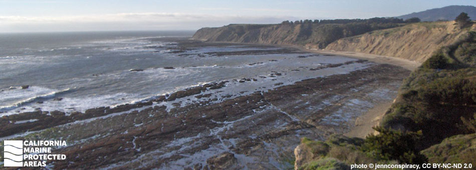 cliffsides adjacent to exposed rock sea floor